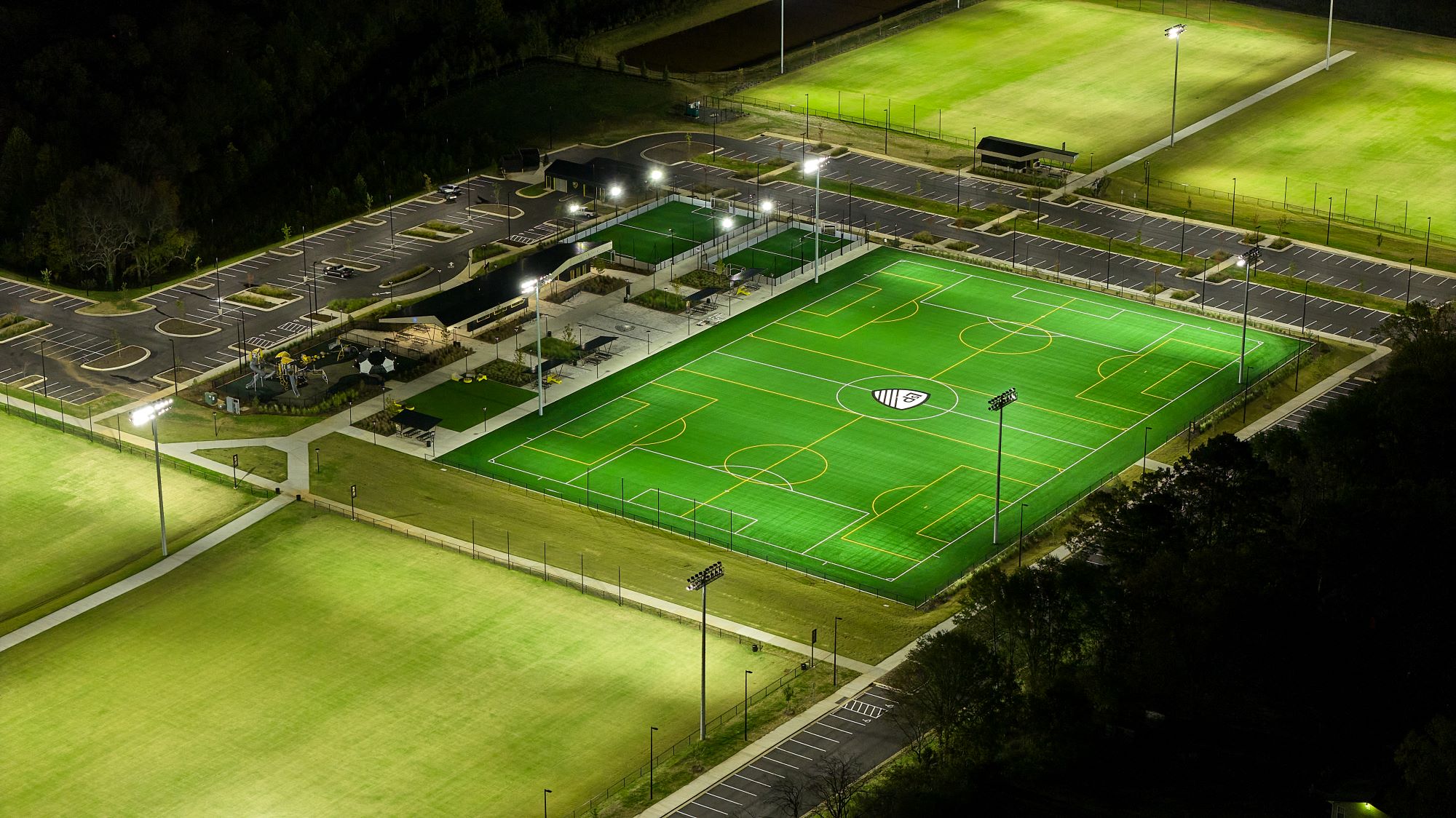 aerial view of the legacy soccer complex campus showing soccer fields, parking lots, and multiple buildings,