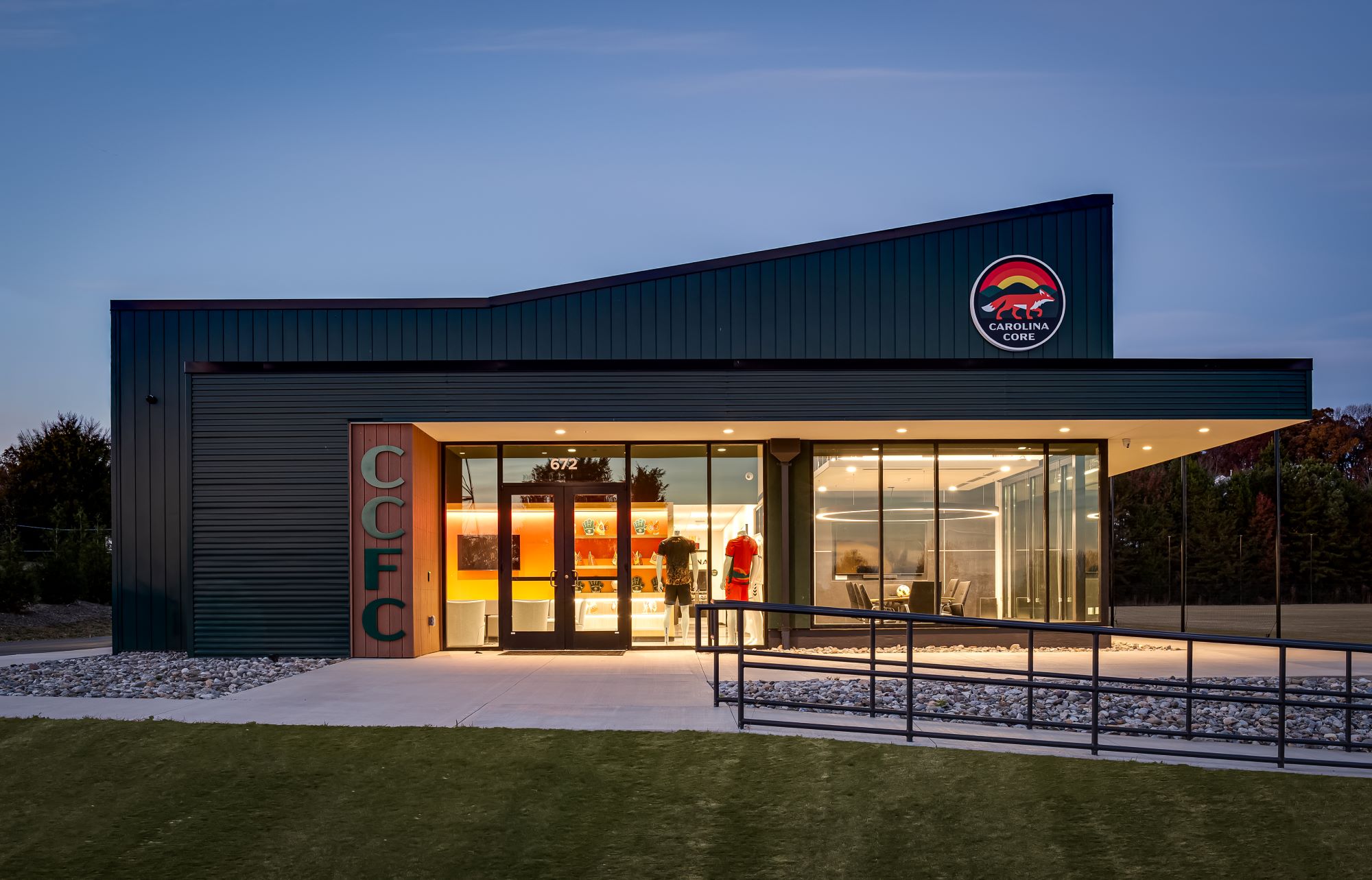 Exterior image of Carolina Core Football Club at sunset, showing the side of the building where the lobby is
